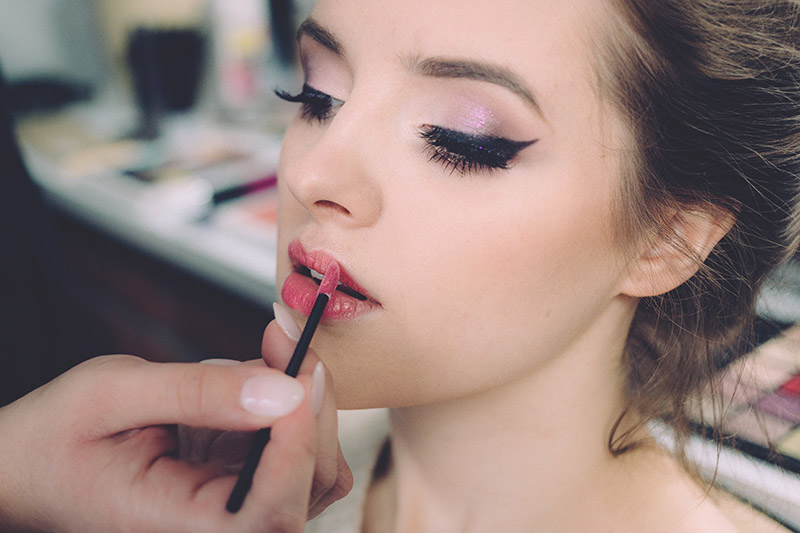 Woman having make up done